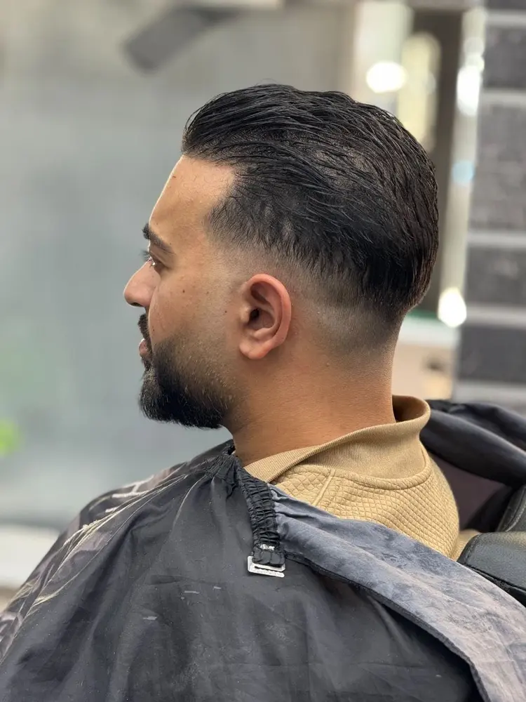 Fade met verzorgde baard bij Barbier Achie